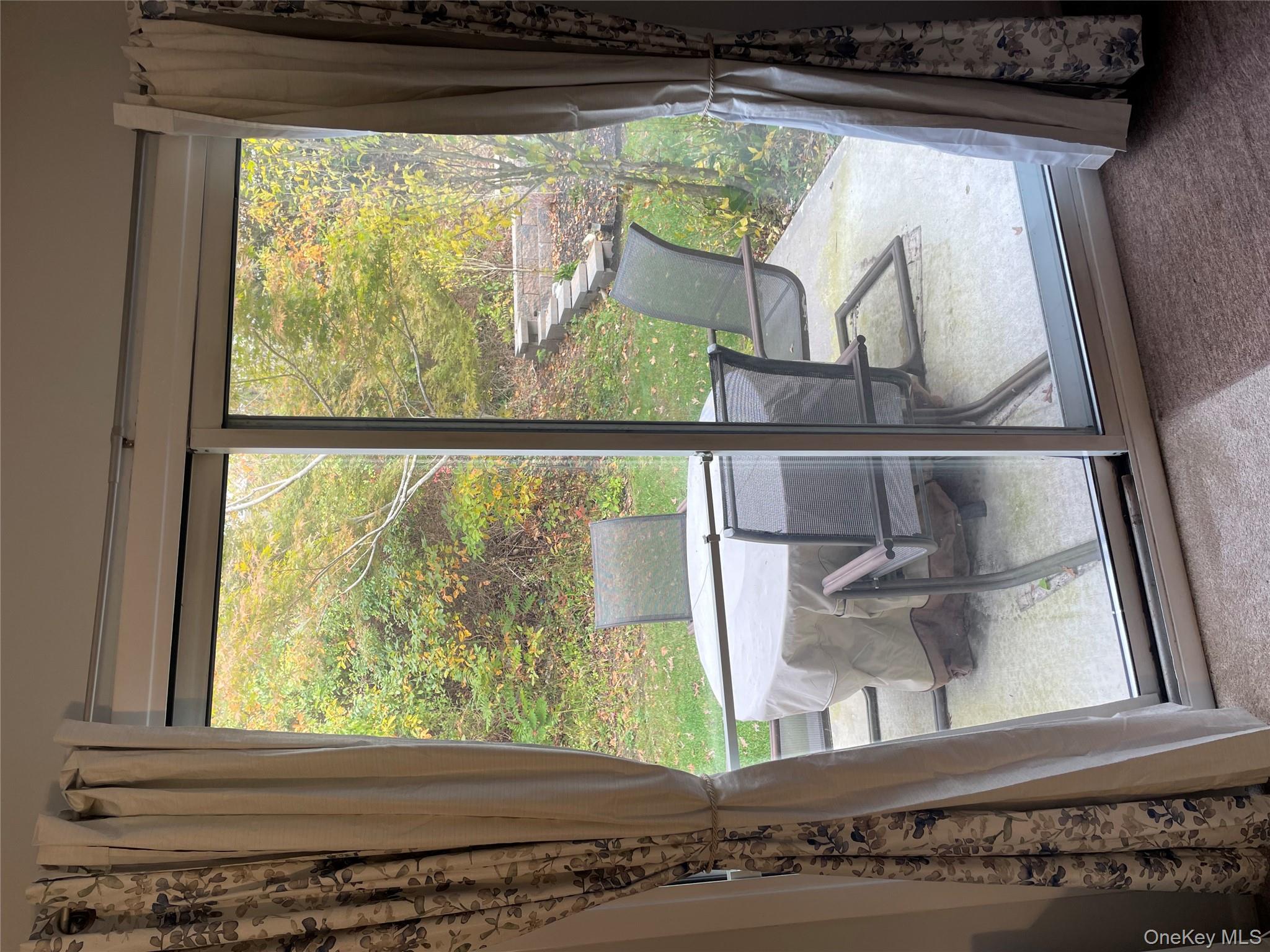 81 Rocky Point Yaphank Road, Unit 145 Rocky Point, NY 11778 - Photo 11 of 11 a room with a large window