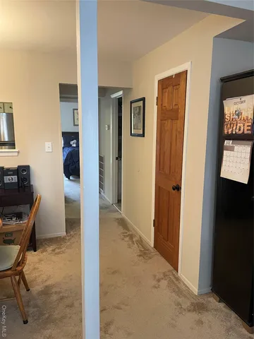 a view of a livingroom with furniture and front door