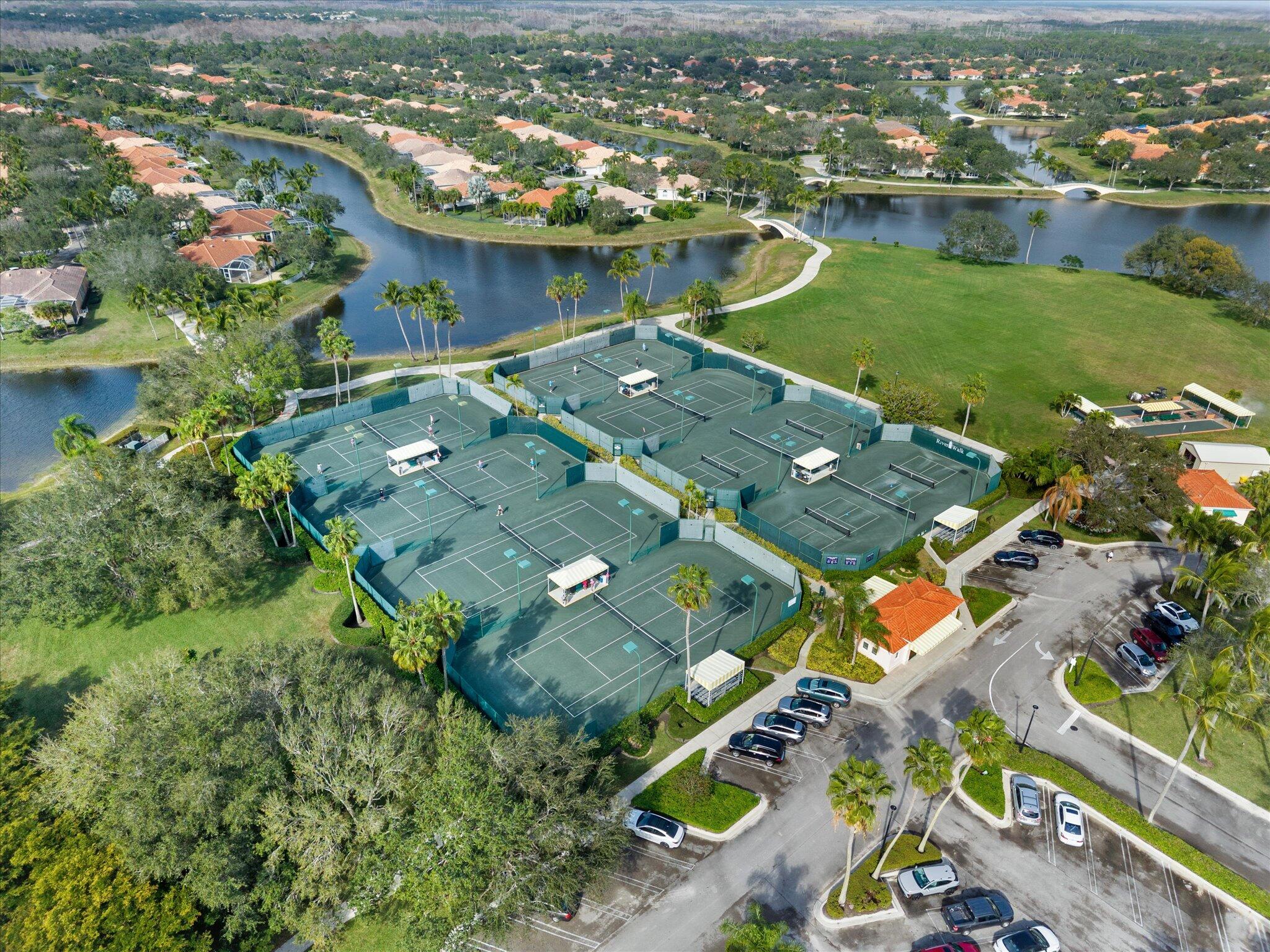 2162 Blue Springs Road West Palm Beach, FL 33411 - Photo 35 of 42 an aerial view of residential houses with outdoor space and river