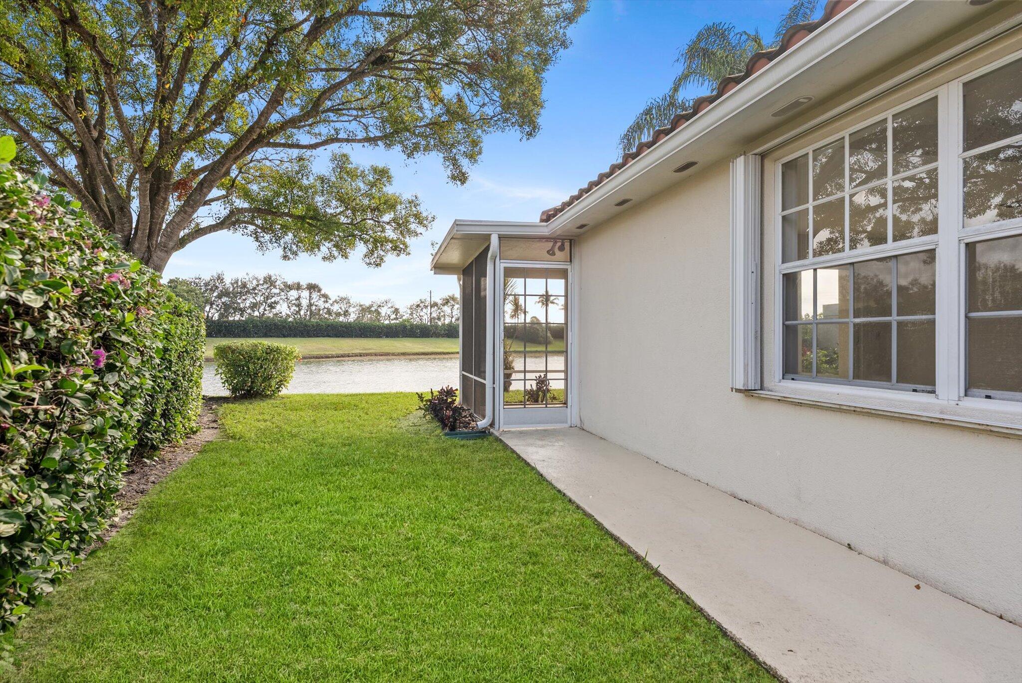 2162 Blue Springs Road West Palm Beach, FL 33411 - Photo 4 of 42 a view of backyard of house with green space