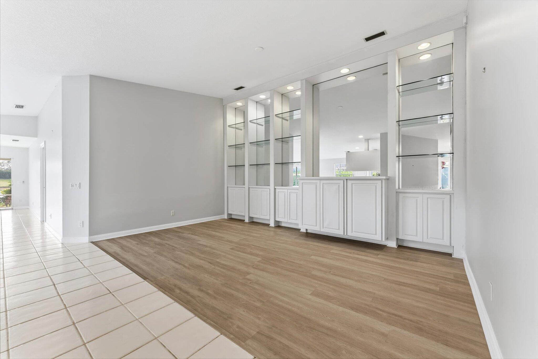 2162 Blue Springs Road West Palm Beach, FL 33411 - Photo 5 of 42 a view of an empty room with wooden floor