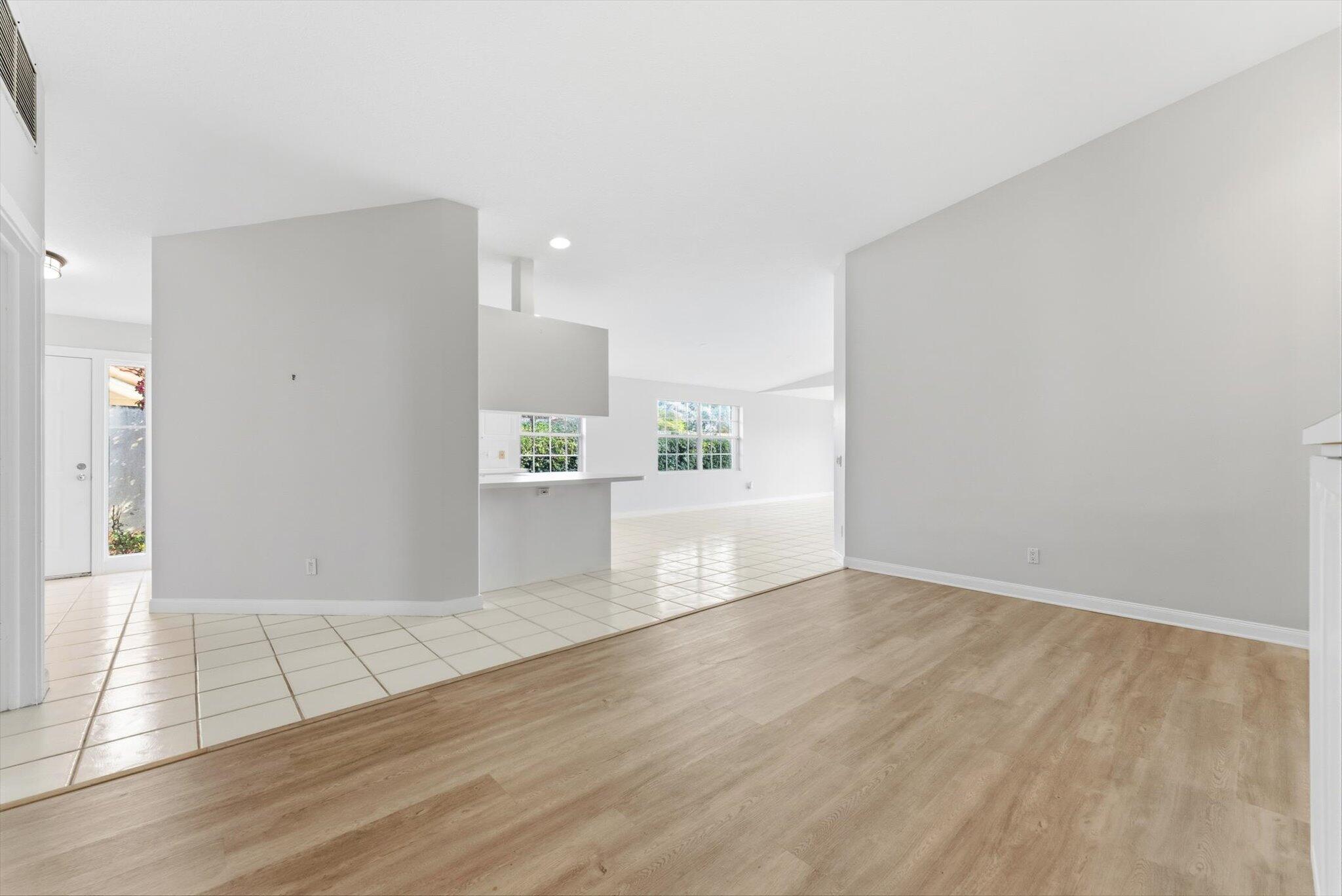 2162 Blue Springs Road West Palm Beach, FL 33411 - Photo 6 of 42 a view of a kitchen with wooden floor and a sink