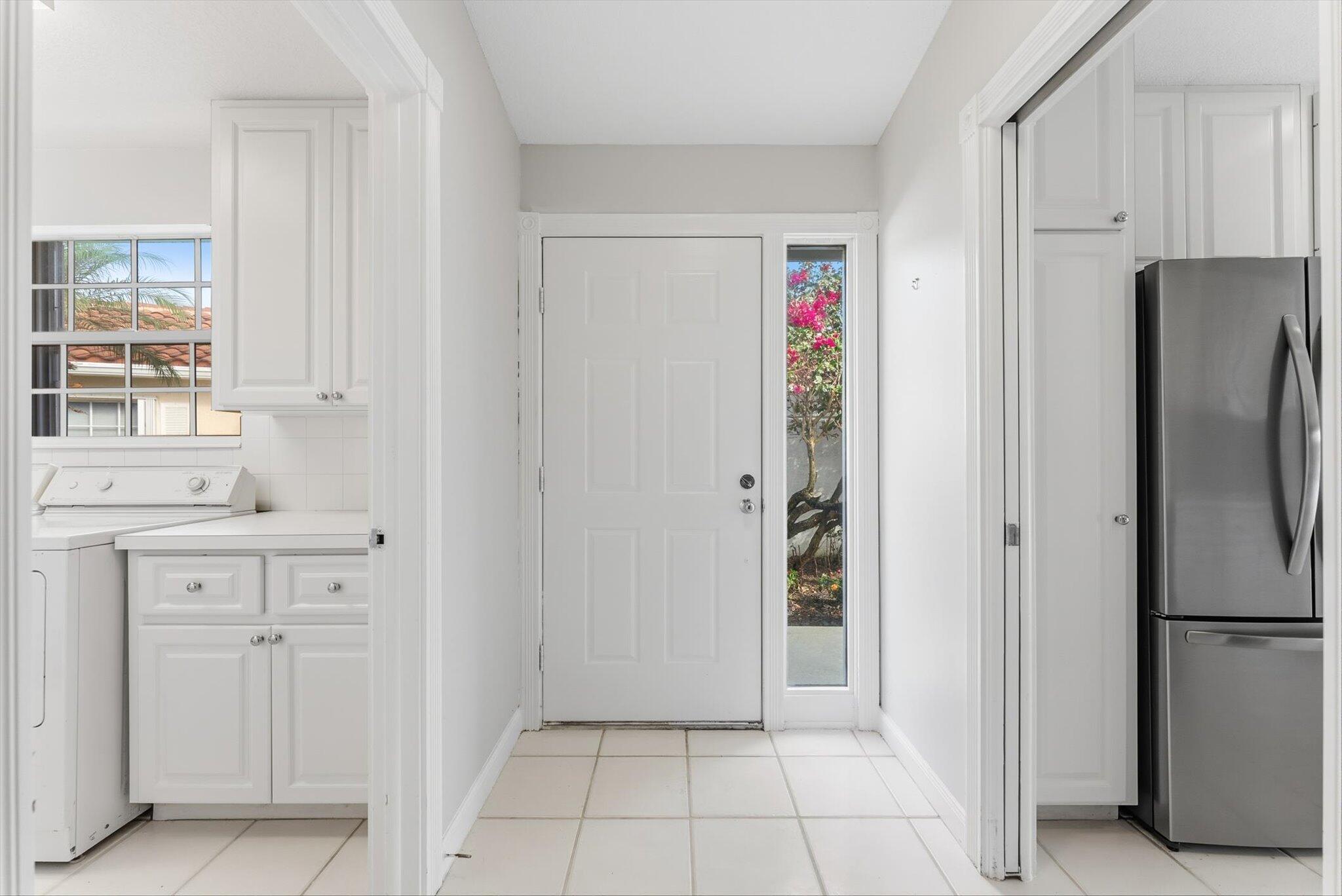 2162 Blue Springs Road West Palm Beach, FL 33411 - Photo 8 of 42 a view of a kitchen with refrigerator and cabinet