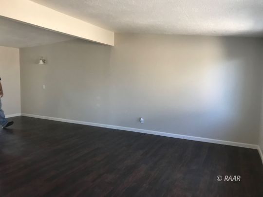 1505 South McCall Street Ridgecrest, CA 93555 - Photo 7 of 17 an empty room with wooden floor