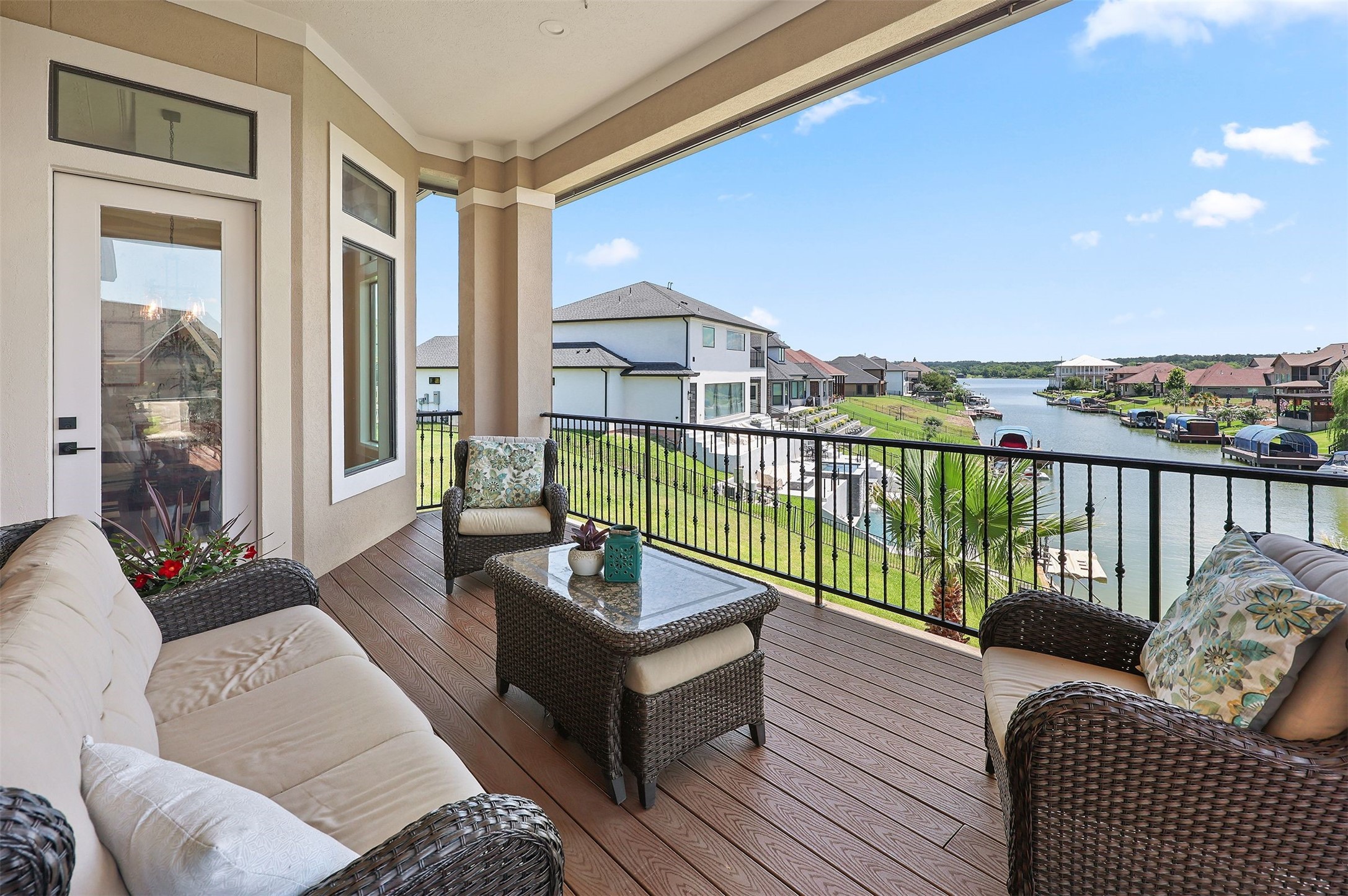 10896 Decatur Street Willis, TX 77318 - Photo 31 of 50 Experience ultimate relaxation on this spacious balcony, offering comfortable seating and breathtaking waterfront views that perfectly frame your scenic retreat.