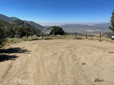 23301 Grindelwald Drive Tehachapi, CA 93561 - Photo 4 of 4 a view of a dry yard with mountain