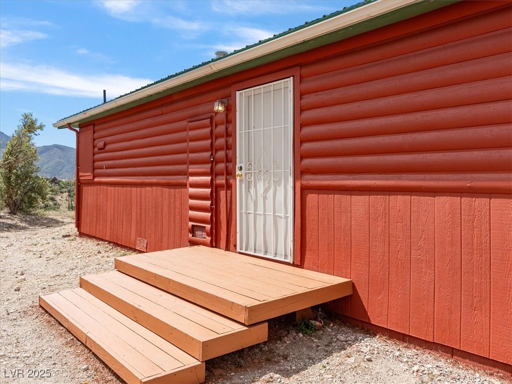 70 West Bonanza Road Las Vegas, NV 89124 - Photo 45 of 71 Wooden terrace with a mountain view and an outbuilding