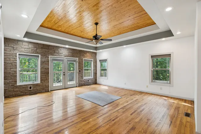 a view of a livingroom with furniture and a window