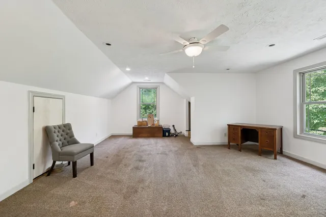 a view of balcony with wooden floor and fence