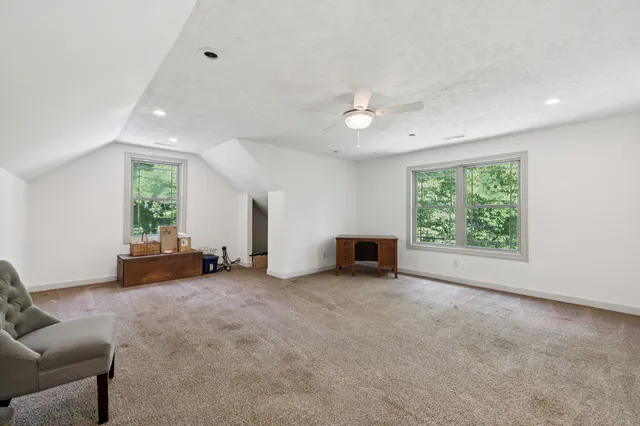 a backyard of a house with lots of trees