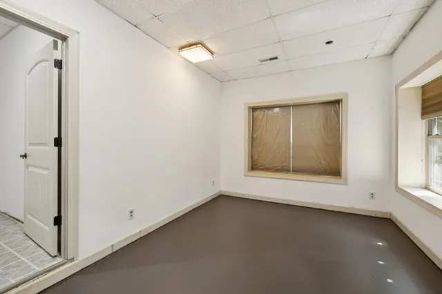 an aerial view of a house with yard