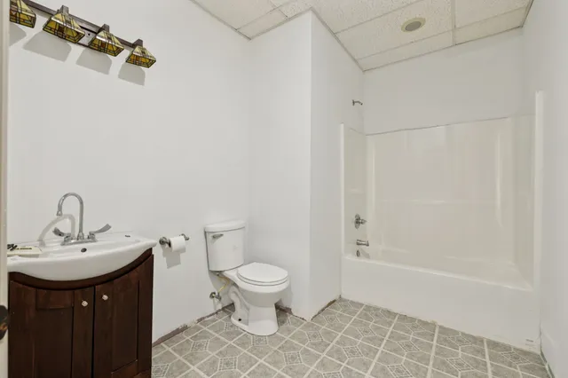 a view of a field of grass and trees