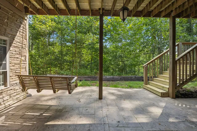 a view of a green field with lots of trees