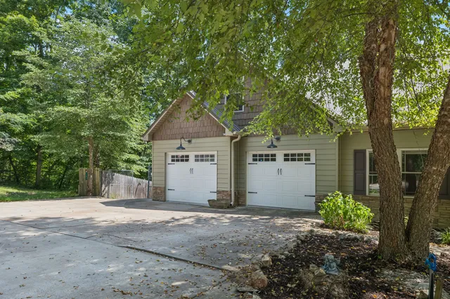 a view of empty room with wooden floor and fireplace