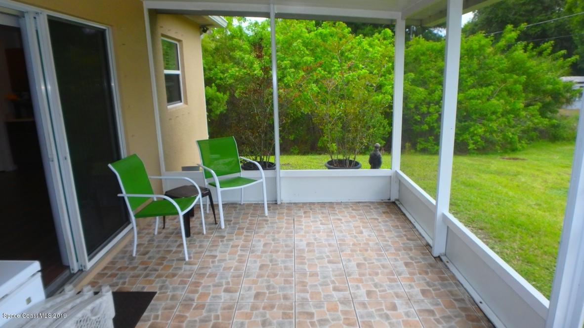 1231 Valleybrook Road Southeast Palm Bay, FL 32909 - Photo 8 of 9 Screened/Tiled Porch