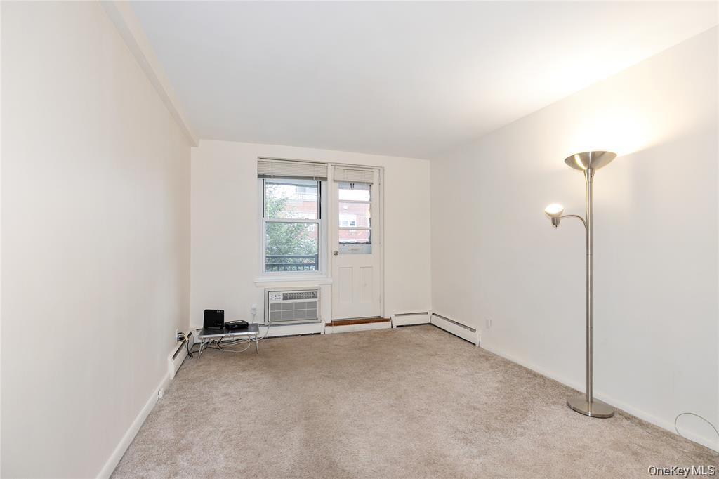 25 Canterbury Road, Unit 2F Great Neck, NY 11021 - Photo 13 of 23 an empty room with windows