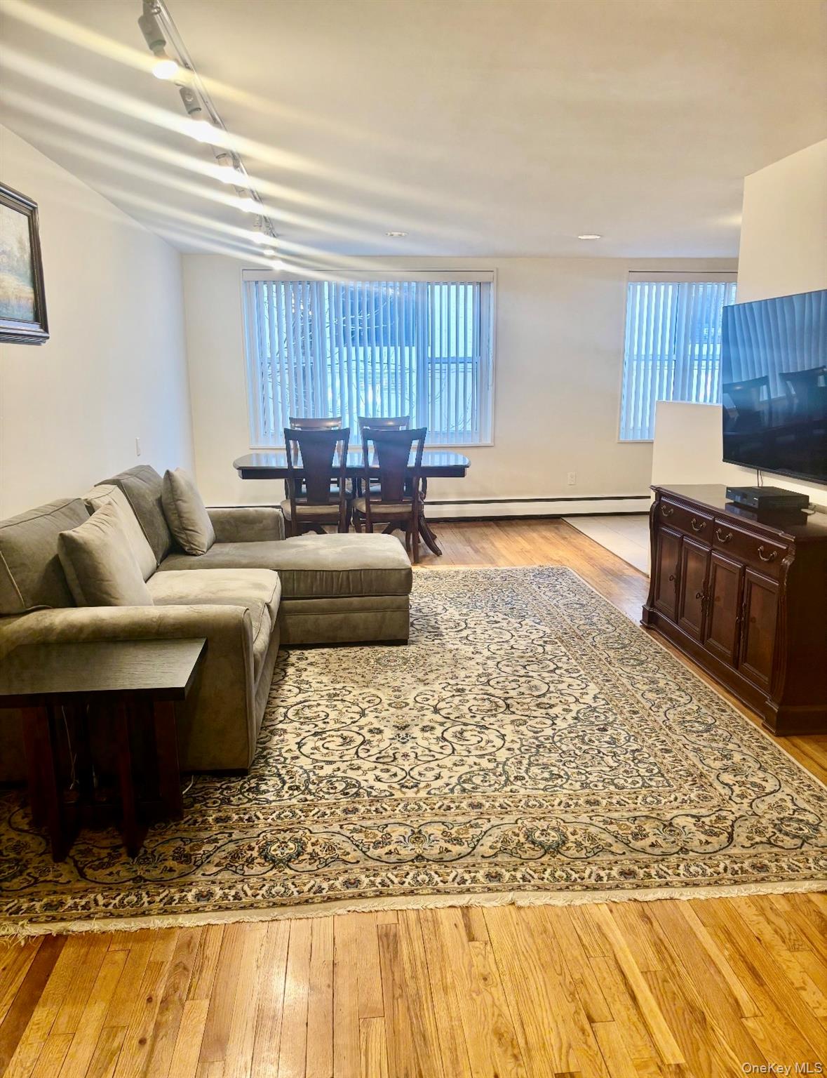 25 Canterbury Road, Unit 2F Great Neck, NY 11021 - Photo 5 of 23 a living room with furniture window and wooden floor