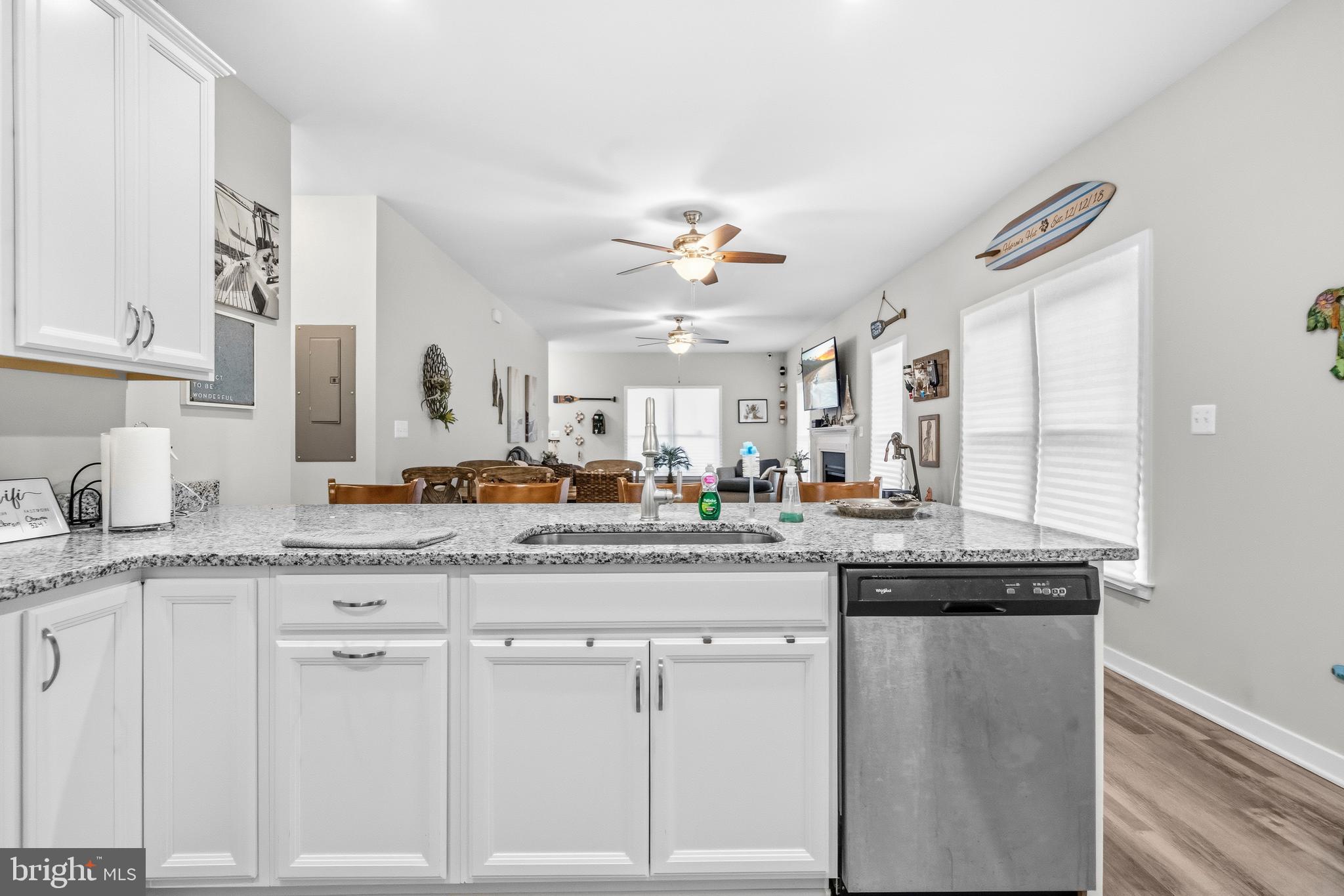 324 3rd Street Colonial Beach, VA 22443 - Photo 13 of 37 a kitchen with granite countertop white cabinets and a granite counter tops