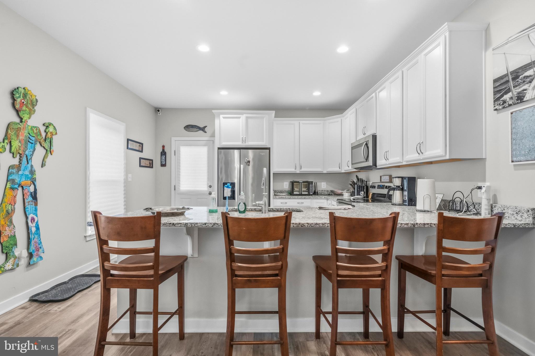 324 3rd Street Colonial Beach, VA 22443 - Photo 15 of 37 a view of a dining room with furniture and wooden floor