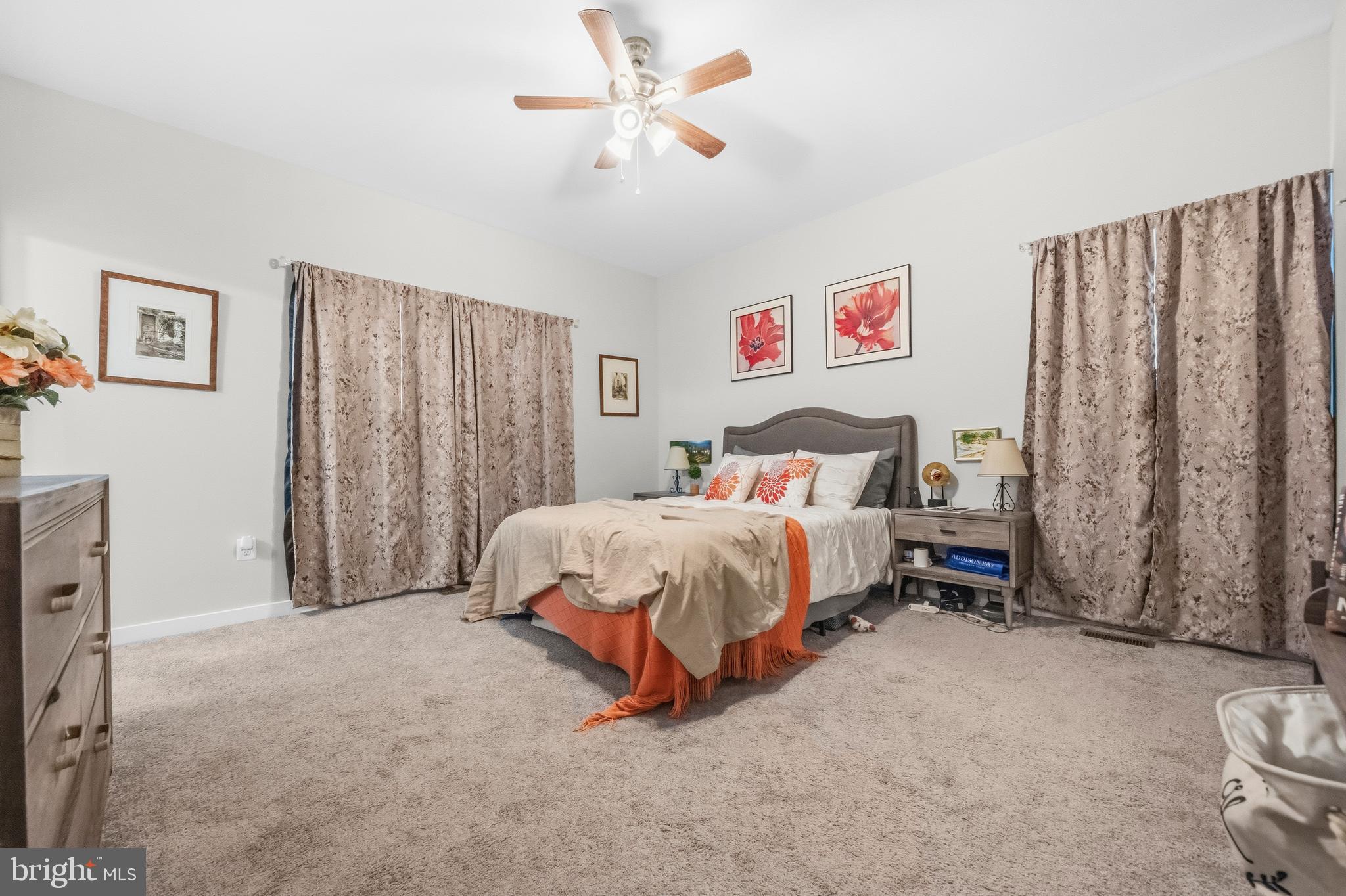 324 3rd Street Colonial Beach, VA 22443 - Photo 17 of 37 a bed room with a bed and a chair