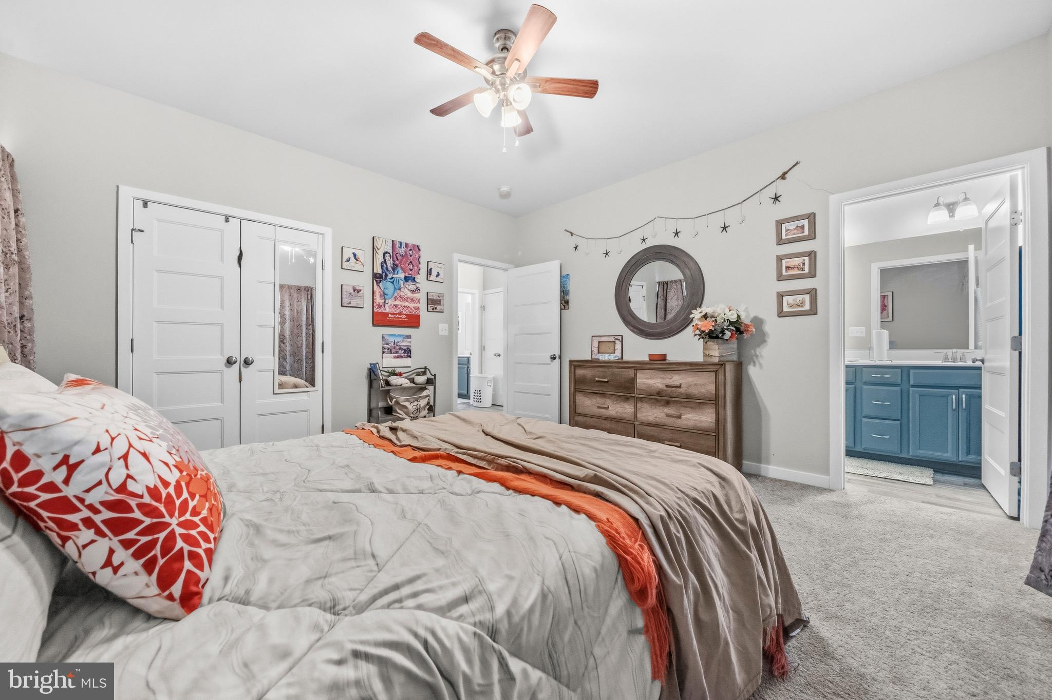 324 3rd Street Colonial Beach, VA 22443 - Photo 19 of 37 a bedroom with a bed and a chandelier