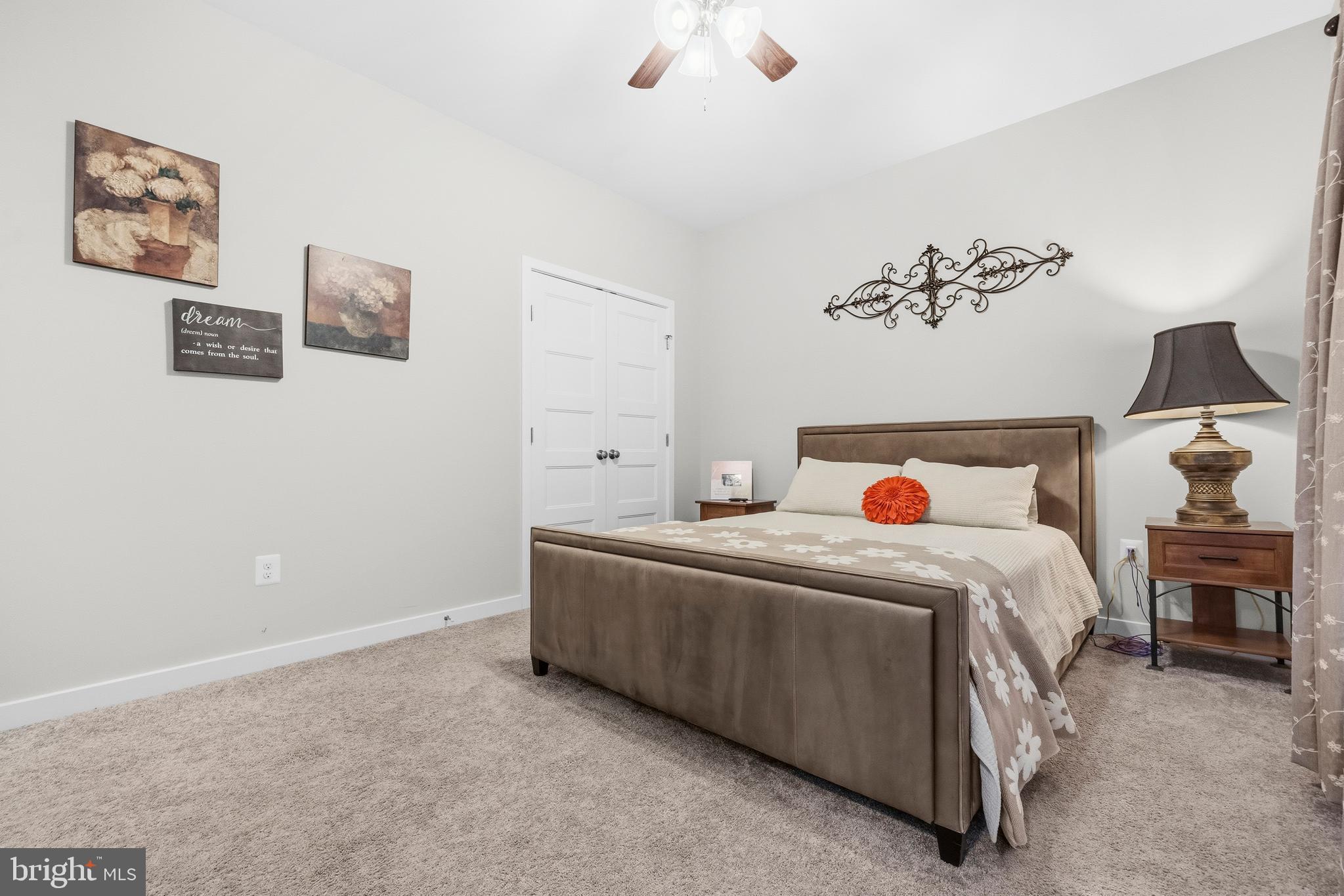 324 3rd Street Colonial Beach, VA 22443 - Photo 21 of 37 a bed room with a bed and a couch