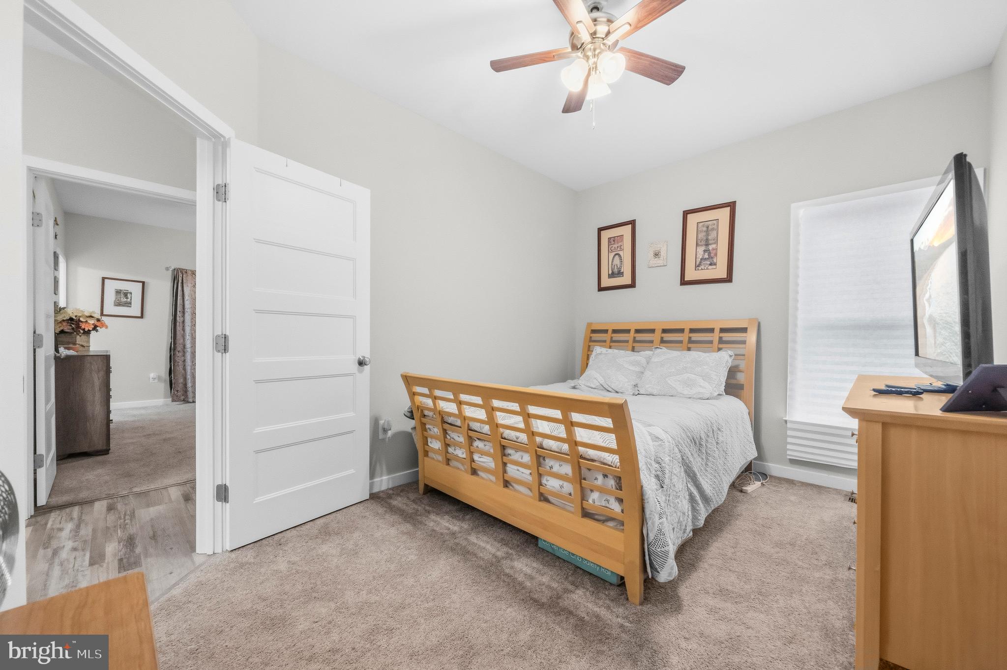 324 3rd Street Colonial Beach, VA 22443 - Photo 23 of 37 a bedroom with a bed and a chandelier