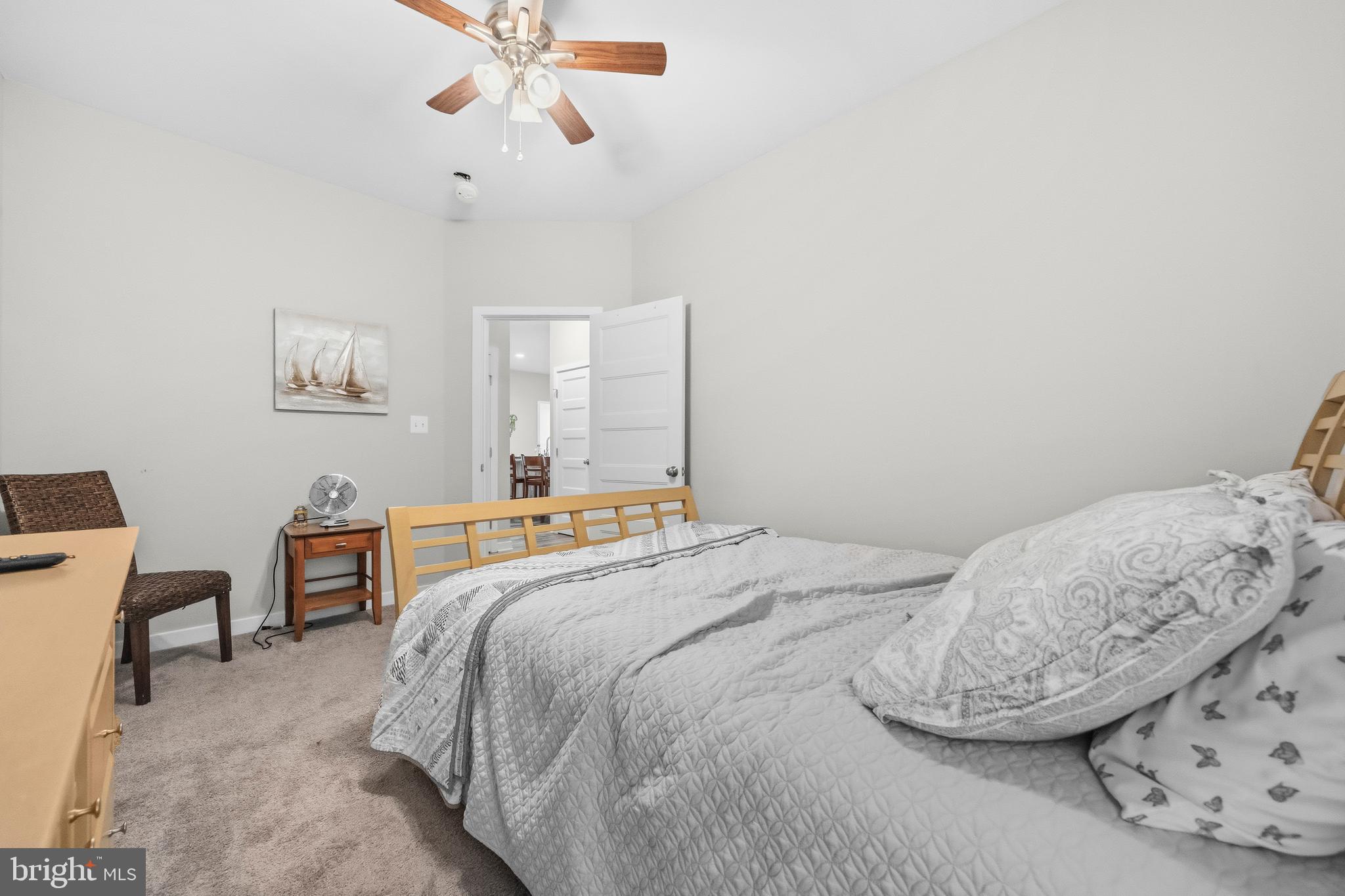 324 3rd Street Colonial Beach, VA 22443 - Photo 24 of 37 a bedroom with a bed and chair