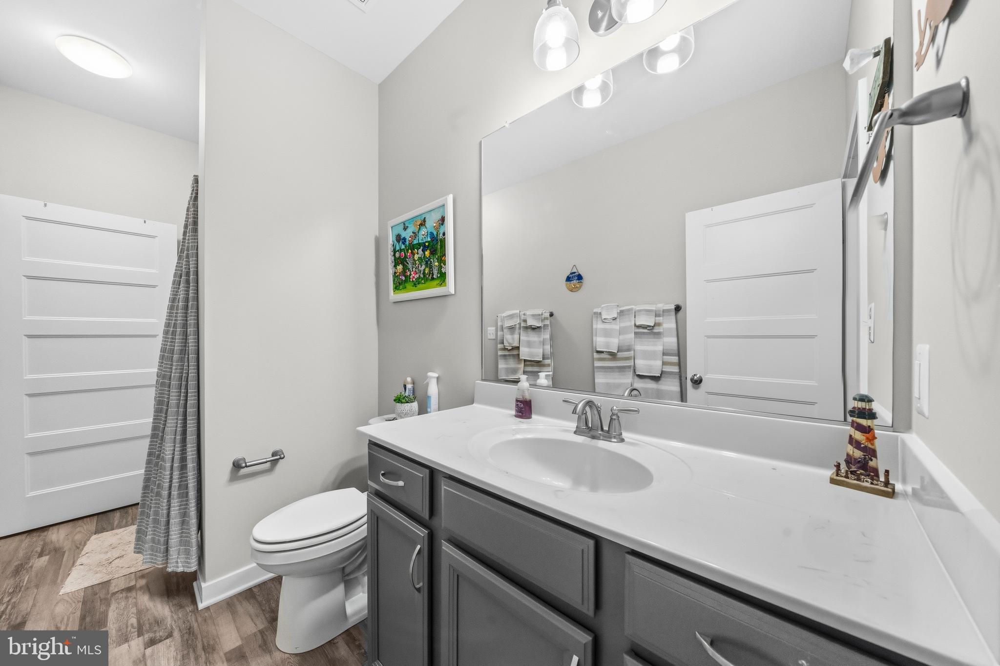 324 3rd Street Colonial Beach, VA 22443 - Photo 25 of 37 a bathroom with a sink a toilet and shower