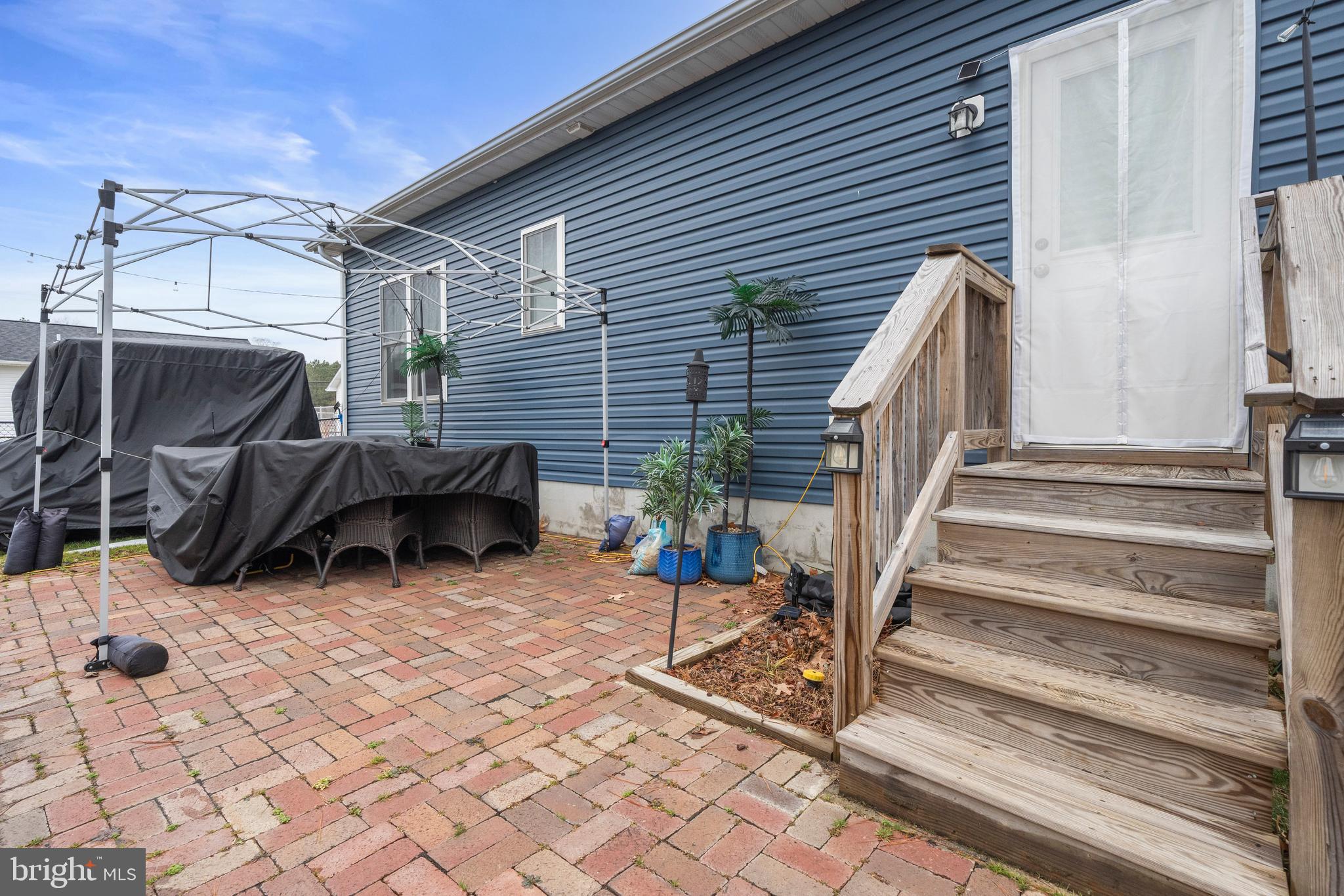 324 3rd Street Colonial Beach, VA 22443 - Photo 28 of 37 a view of a patio with a chairs in patio