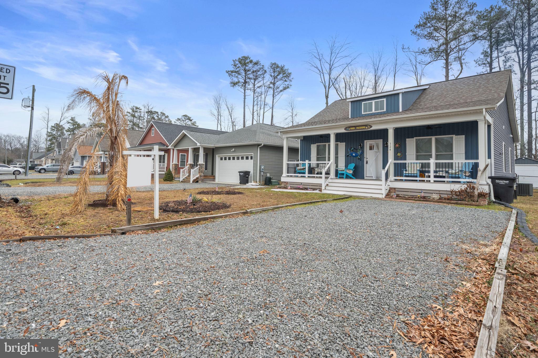 324 3rd Street Colonial Beach, VA 22443 - Photo 33 of 37 front view of a house with a yard