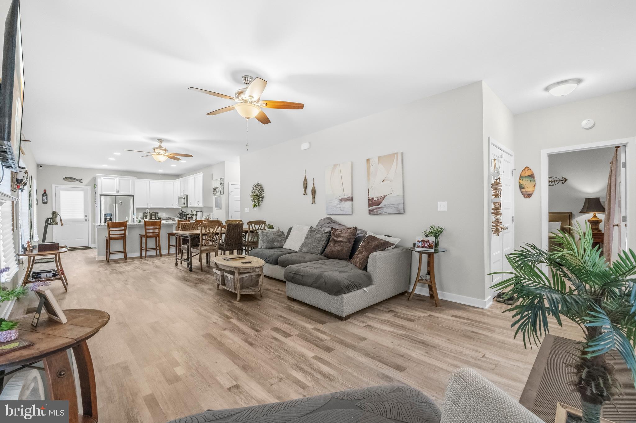324 3rd Street Colonial Beach, VA 22443 - Photo 5 of 37 a living room with furniture kitchen view and a potted plant