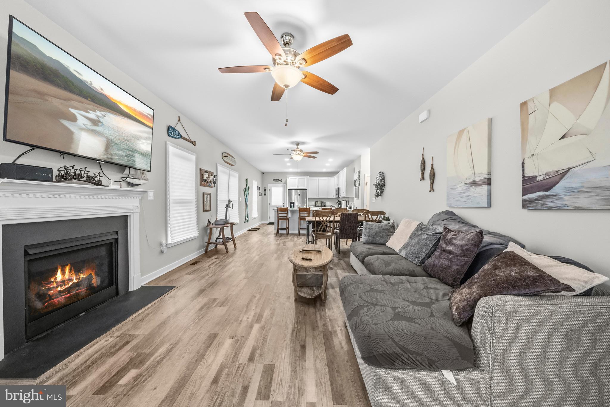 324 3rd Street Colonial Beach, VA 22443 - Photo 6 of 37 a living room with furniture a fireplace and a flat screen tv