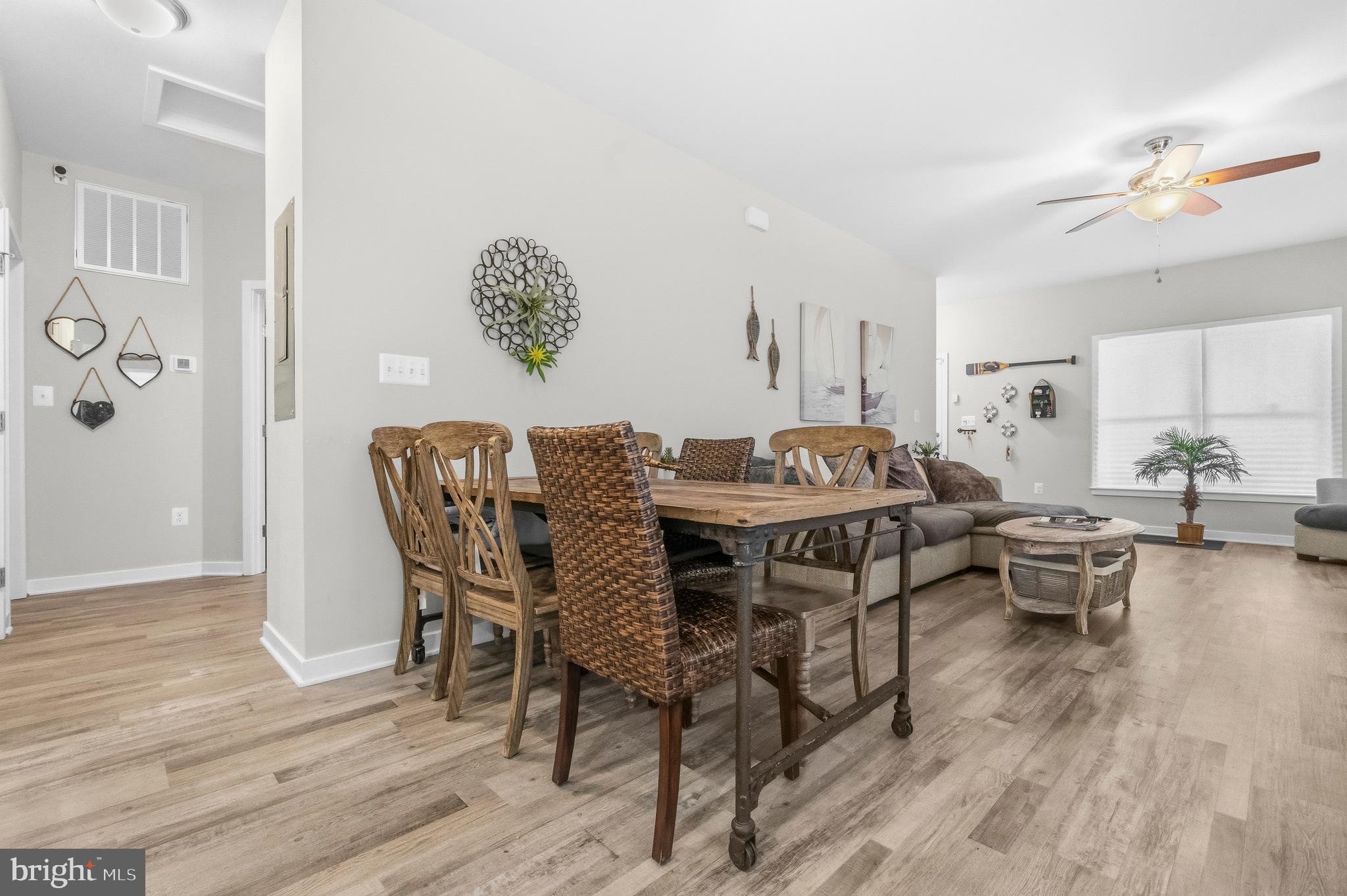 324 3rd Street Colonial Beach, VA 22443 - Photo 8 of 37 a dining room with furniture potted plants and wooden floor