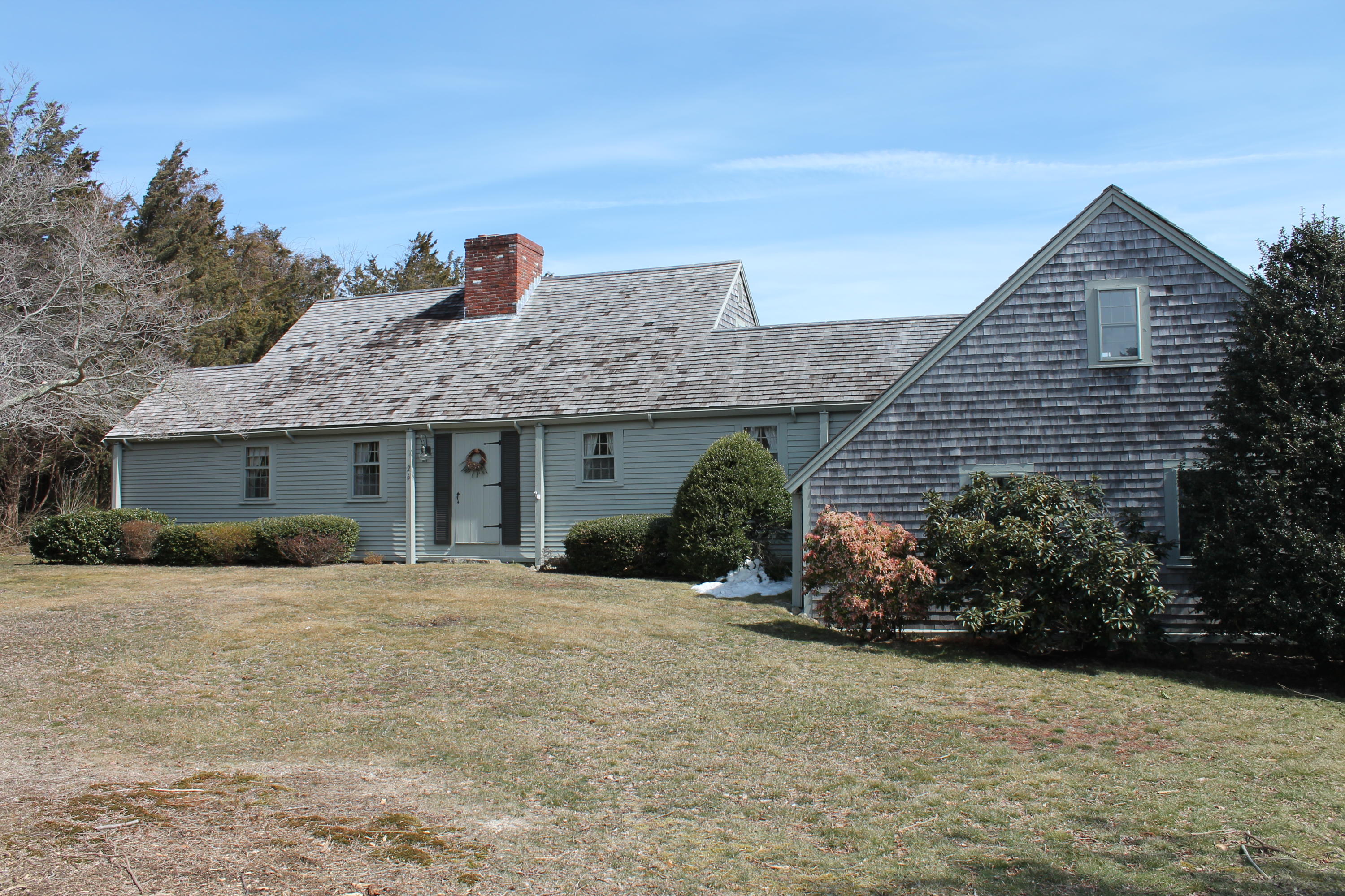26 Point Hill Road West Barnstable, MA 02668 - Photo 1 of 23 a front view of a house with a yard and potted plants