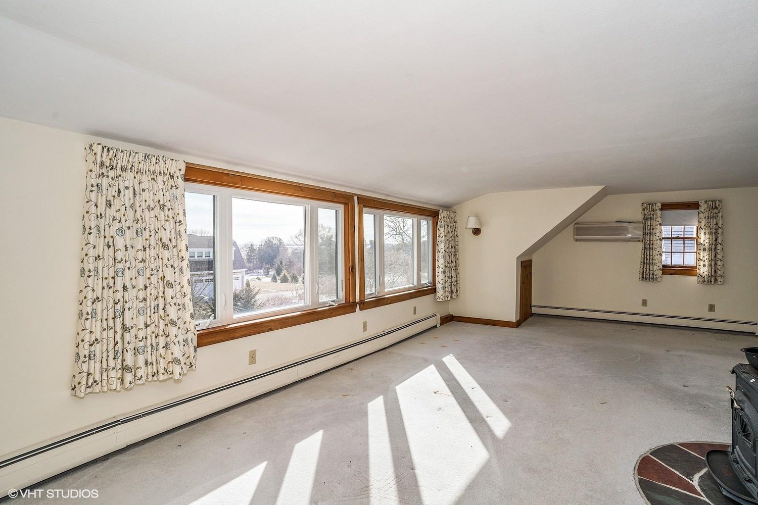 26 Point Hill Road West Barnstable, MA 02668 - Photo 13 of 23 a view of a big room with windows and chandelier