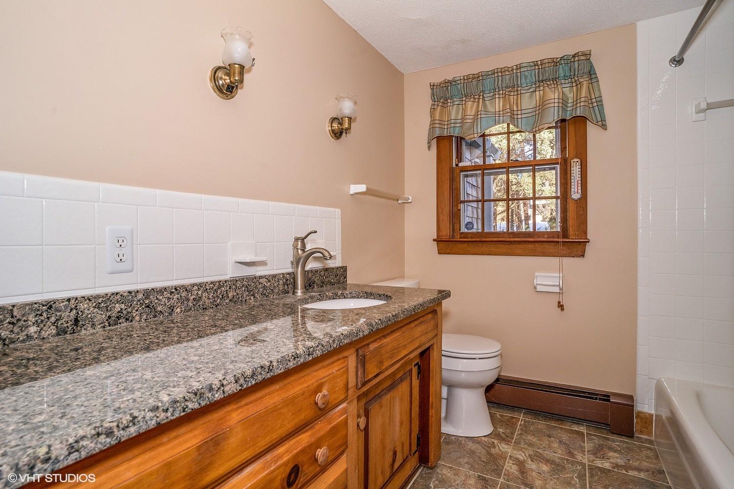 26 Point Hill Road West Barnstable, MA 02668 - Photo 15 of 23 a bathroom with a granite countertop sink a toilet and a shower