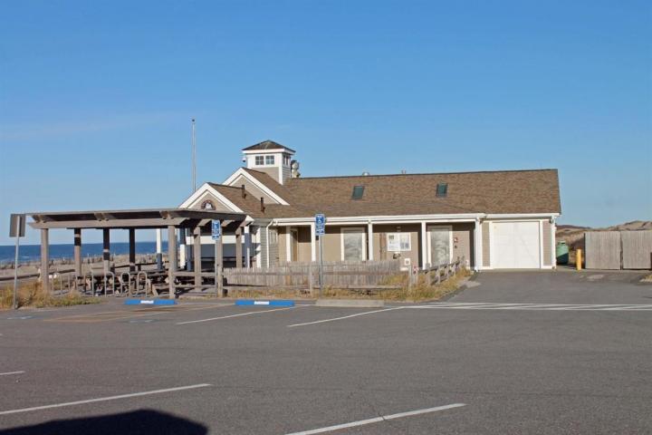 26 Point Hill Road West Barnstable, MA 02668 - Photo 20 of 23 a front view of a building with lots of trees