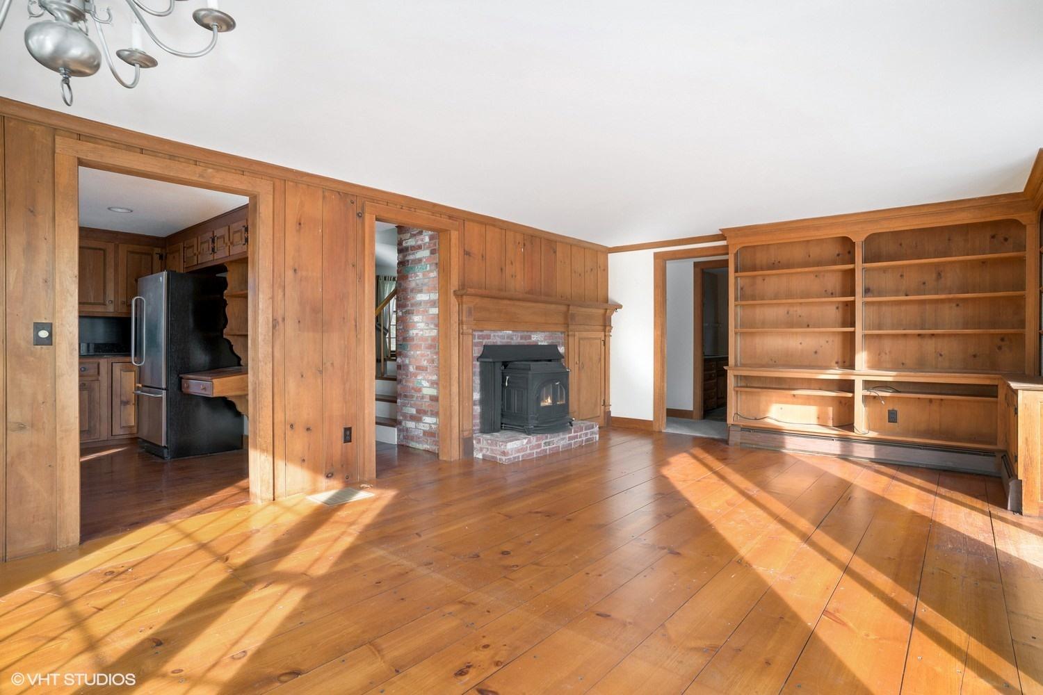 26 Point Hill Road West Barnstable, MA 02668 - Photo 3 of 23 a view of an empty room with a fireplace and a window