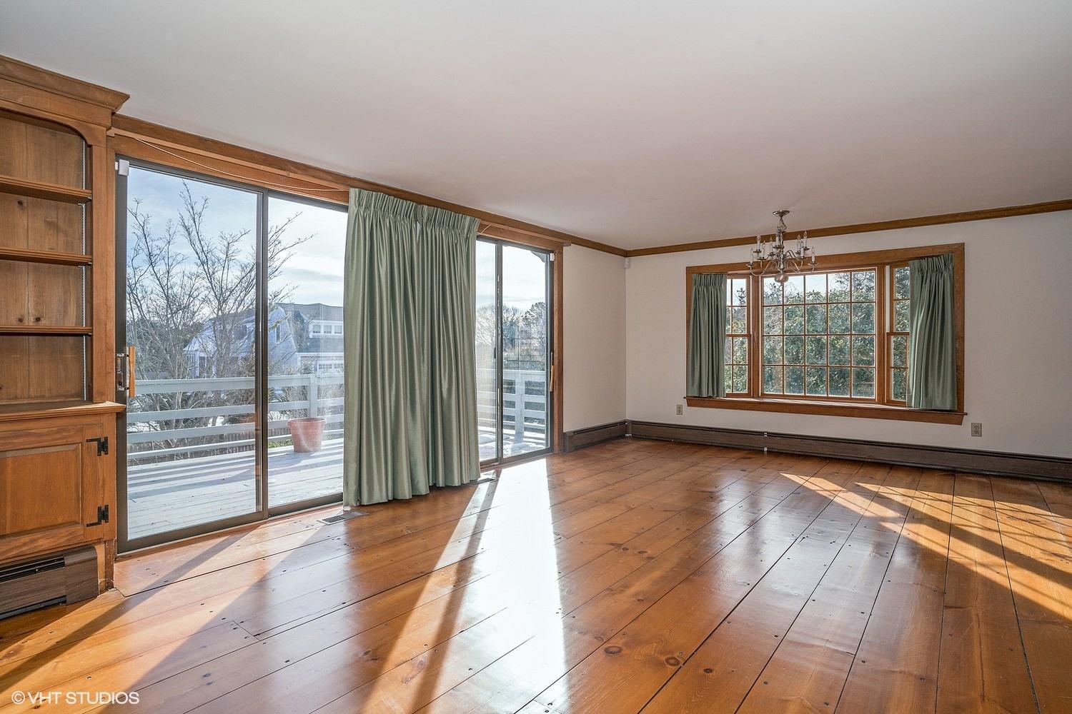 26 Point Hill Road West Barnstable, MA 02668 - Photo 4 of 23 wooden floor in an empty room with a window