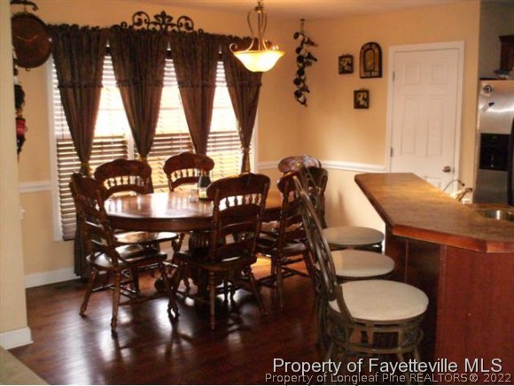 211 Booth Pond Road Raeford, NC 28376 - Photo 13 of 25 a dining room with furniture and window