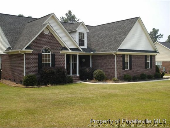 211 Booth Pond Road Raeford, NC 28376 - Photo 2 of 25 a front view of a house with a yard