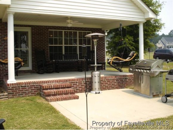 211 Booth Pond Road Raeford, NC 28376 - Photo 23 of 25 a view of house with outdoor space