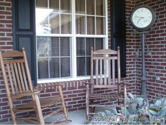 211 Booth Pond Road Raeford, NC 28376 - Photo 3 of 25 a view of a chair with a small deck
