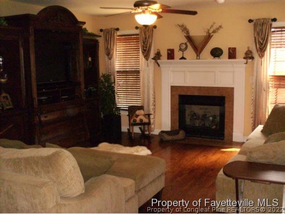 211 Booth Pond Road Raeford, NC 28376 - Photo 4 of 25 a living room with furniture and a fireplace