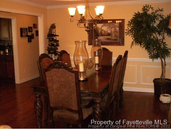 211 Booth Pond Road Raeford, NC 28376 - Photo 8 of 25 a view of a dining room with furniture and wooden floor
