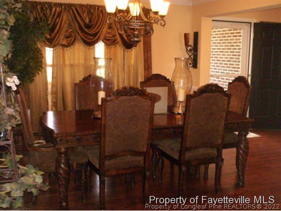 211 Booth Pond Road Raeford, NC 28376 - Photo 10 of 25 a view of a dining room with furniture and window