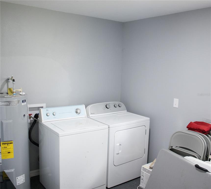 6130 Fussell Road Polk City, FL 33868 - Photo 11 of 21 a utility room with dryer and washer