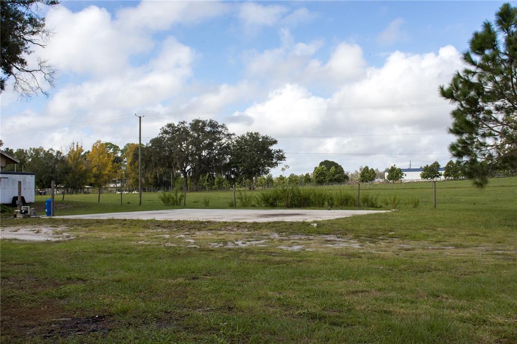 6130 Fussell Road Polk City, FL 33868 - Photo 17 of 21 a view of a field with a big trees