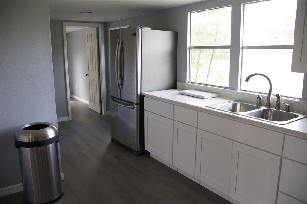 6130 Fussell Road Polk City, FL 33868 - Photo 4 of 21 a kitchen with a sink and a window
